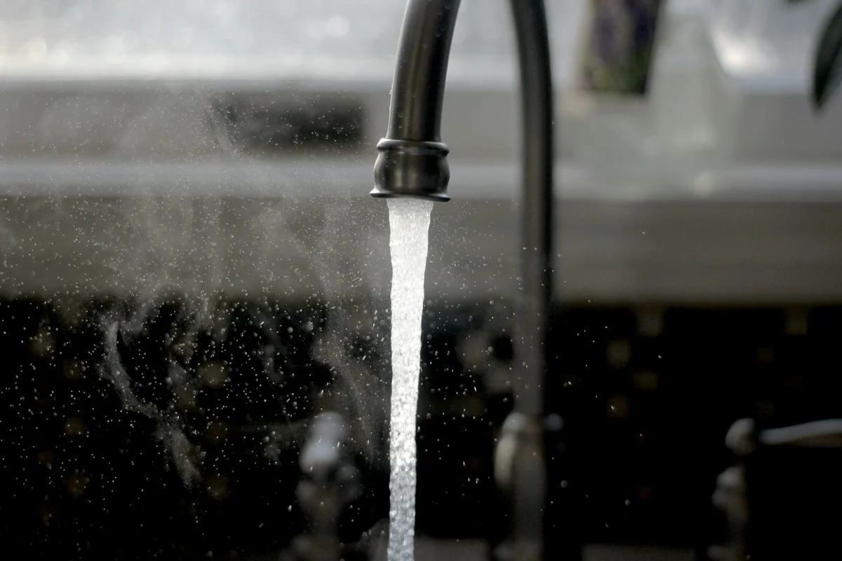 Running water at a kitchen sink