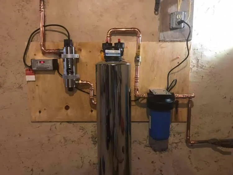 Water treatment installation and connected plumbing
